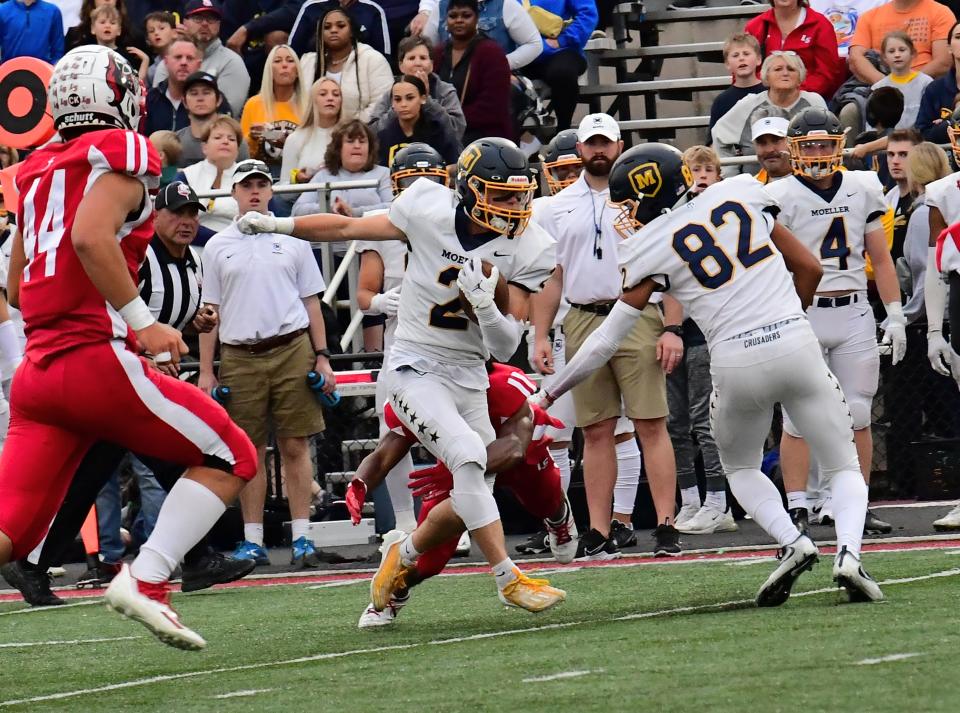 Moeller's Ryan Mechley takes in a pass and gains first-down yards for the Crusaders at the Moeller vs. La Salle GCL-South football game, Sept. 23, 2022.