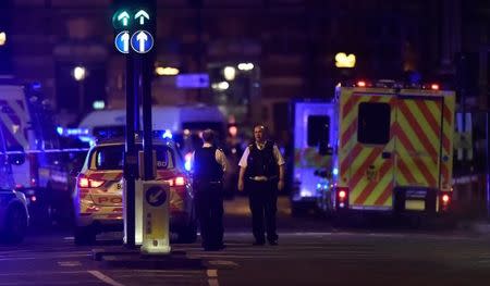 Police attend to an incident on London Bridge in London, Britain, June 3, 2017. Reuters / Hannah McKay