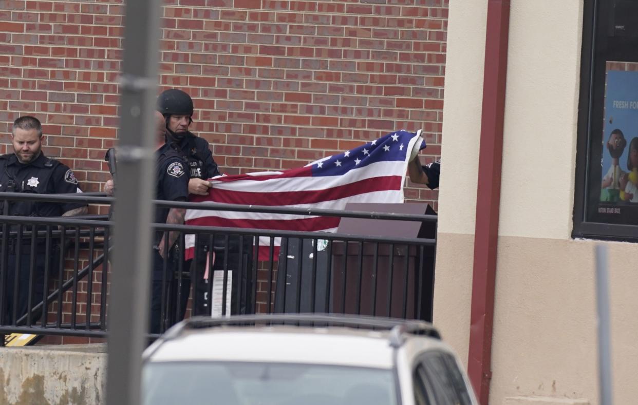 Police work on the scene outside of a King Soopers grocery store where a shooting took place Monday, March 22, 2021, in Boulder, Colo.