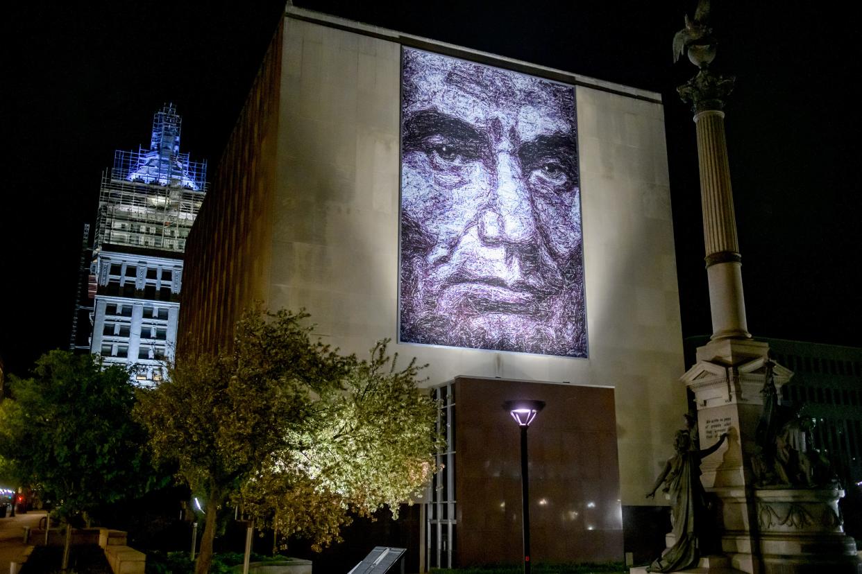 "Abraham Blue" peers down from the side of the Peoria County Courthouse in downtown Peoria. The 30-by-50-foot mural was created by local artist Doug Leunig and unveiled in October of 2018.