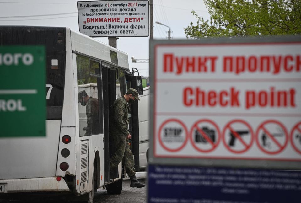 A Transnistrian serviceman gets off a bus after checking passengers entering the self-proclaimed Moldovan Republic of Transnistria at Varnita border point with Moldova on April 28, 2022. / Credit: DANIEL MIHAILESCU/AFP via Getty Images