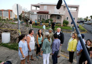 <p>President Donald Trump talks with local residents during a walking tour with first lady Melania Trump of areas damaged by Hurricane Maria in Guaynabo, Puerto Rico, Oct. 3, 2017. (Photo: Jonathan Ernst/Reuters) </p>