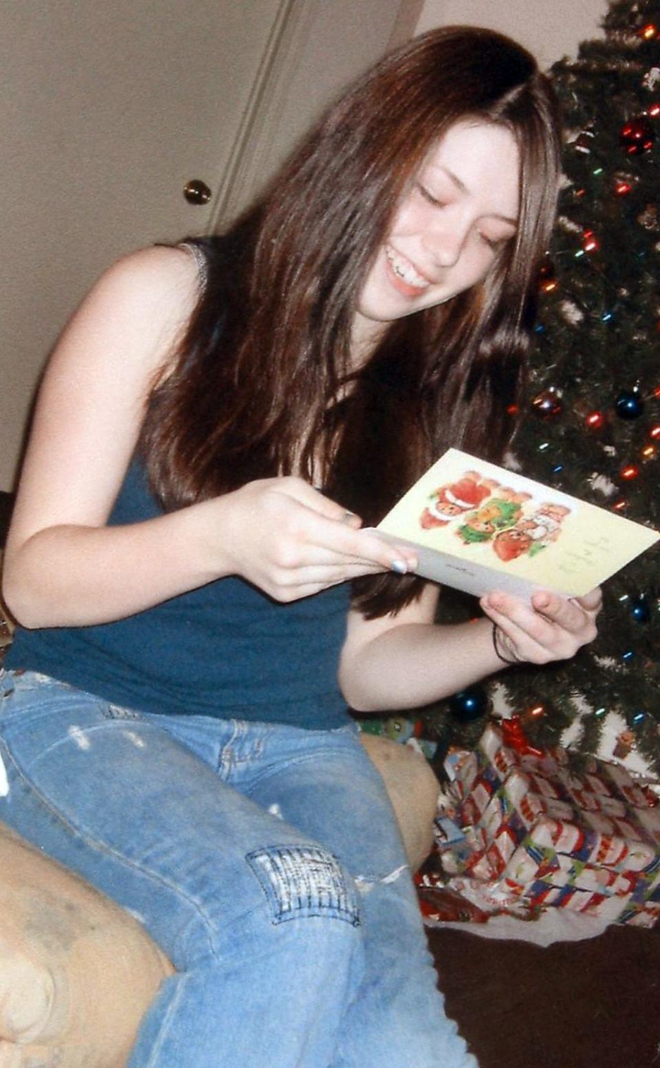 Photo courtesy of Elizabeth Crecente....Jennifer Crecente is shown at a Christmas party in 2005.  She was murdered in February when she was 18.  Her mother, Elizabeth, hopes to preserve the memory of her only daughter by starting Jennifer's Hope, a non-profit partnership with SafePlace to reach out to young victims of dating violence.  She says creating the organization is her way of coping with her grief and fighting to make her life meaningful.