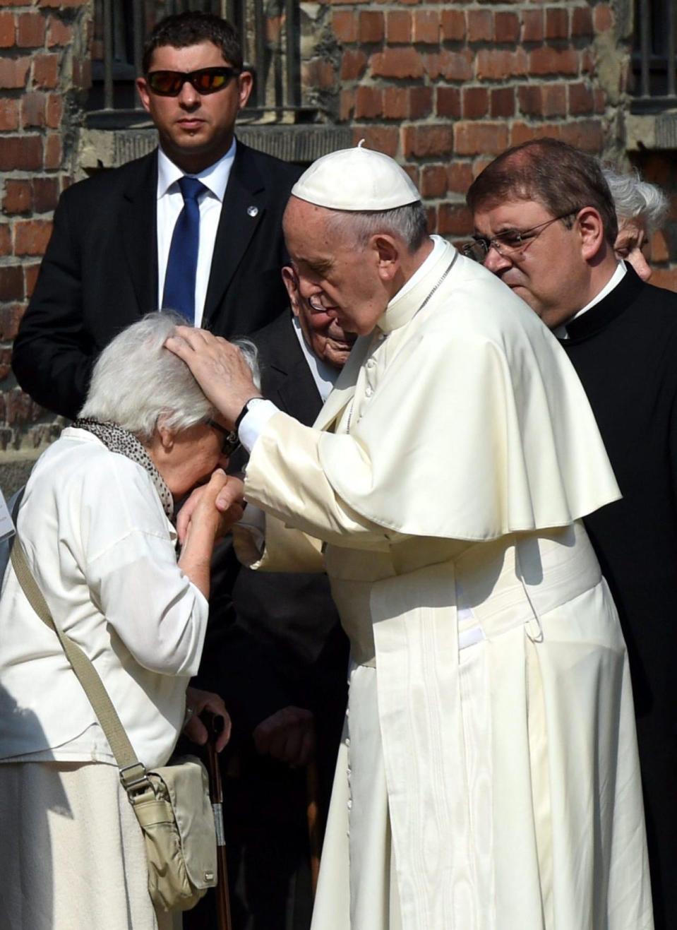 Pope Francis blesses a former woman inmate of the Auschwitz concentration camp  during a visit to the camp  Auschwitz I in Oswiecim, Poland, 29 July 2016. Pope Francis visits the site of former Nazi German concentration camp Auschwitz II - Birkenau, as part of his visit to Poland. (EPA/RADEK PIETRUSZKA POLAND OUT)