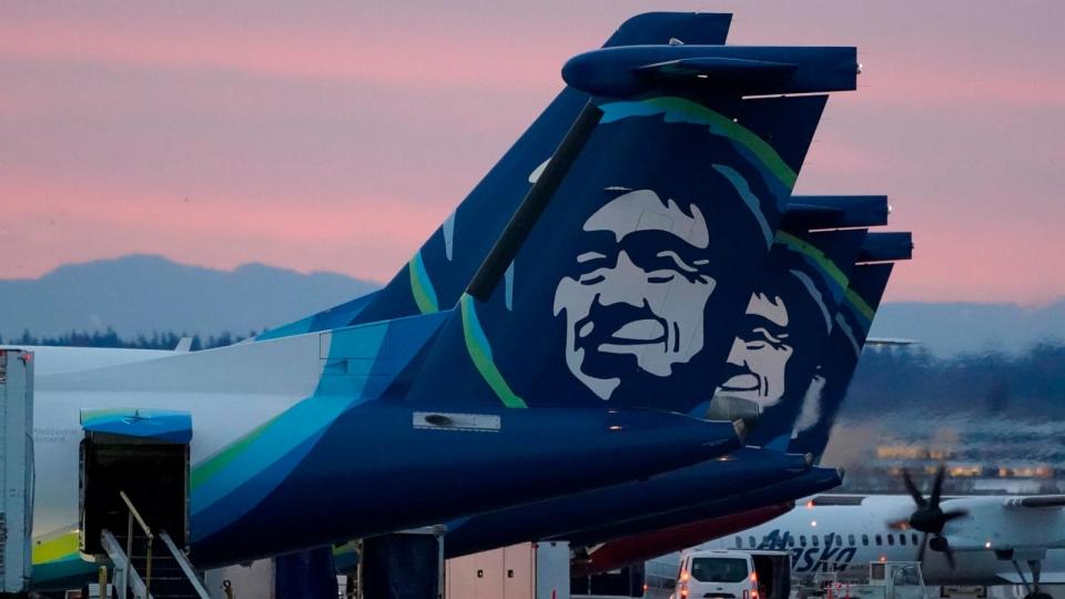 PHOTO: In this file photo, Alaska Airlines planes are shown parked at gates at sunrise, March 1, 2021, at Seattle-Tacoma International Airport in Seattle, Washington.  (Ted S. Warren/AP)