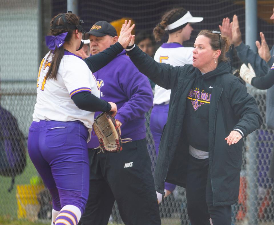 Clay coach Katie Rodriguez high fives Haylee Hyduk during the Clay vs. Penn softball game Wednesday, April 27, 2022 at Clay High School. 