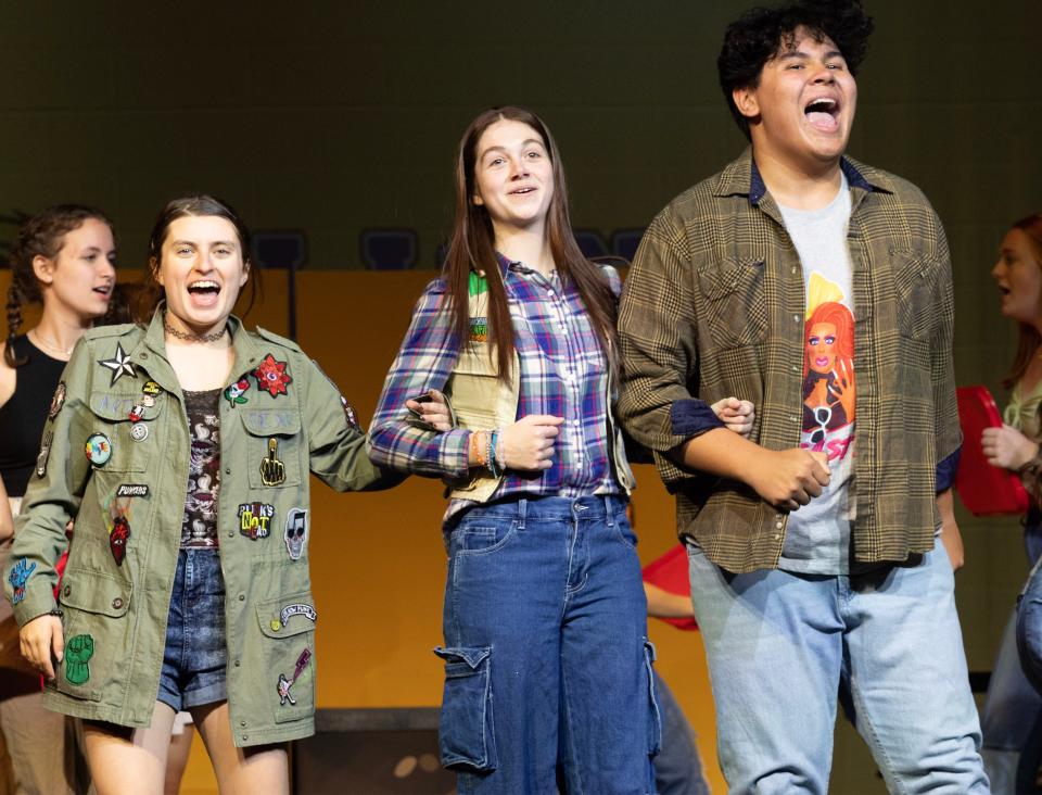 Jordyn Freetage (left) as Janis, Molly Maltempi as Cady and Lucas Cinko as Damian perform a scene from the musical "Mean Girls" during a recent rehearsal.  The North Canton Playhouse is presenting the production starting this weekend.