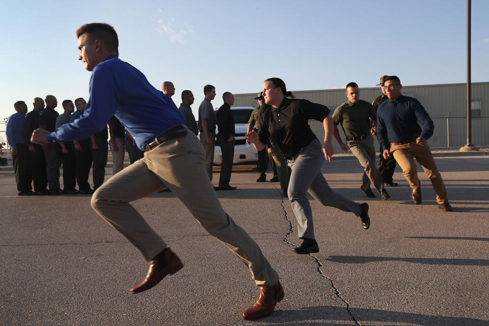 <p>U.S. Border Patrol trainees run upon their initial arrival to the U.S. Border Patrol Academy on August 2, 2017 in Artesia, N.M. (Photo: John Moore/Getty Images) </p>