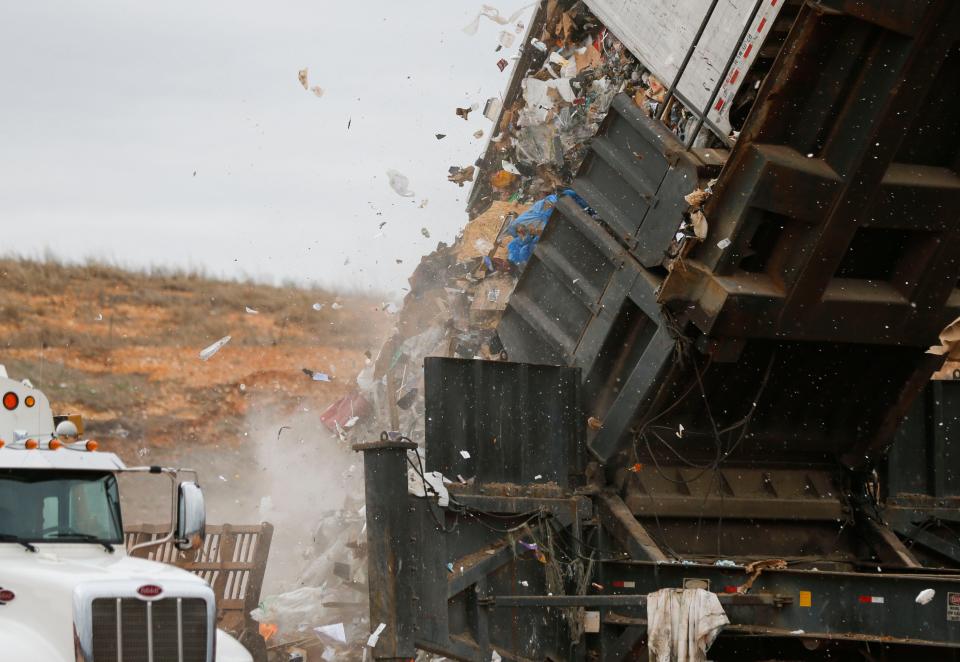 A landfill tipper raises a semi-trailer from a waste transfer station to dump its load into the Springfield Noble Hill Sanitary Landfill in Willard on Thursday, March 2, 2023.