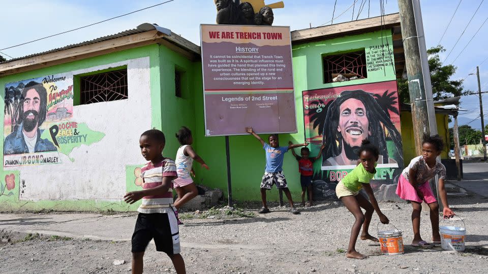 Children play in the Trench Town neighborhood of Kingston, Jamaica on May 18, 2019. In the 1960s, Trench Town was known as the Hollywood of Jamaica and is the birthplace of reggae music, as well as the home of Bob Marley. - Angela Weiss/AFP/Getty Images