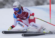 Corinne Suter, from Switzerland, skis down the course during the women's World Cup downhill in Lake Louise, Alberta, on Saturday, Dec. 4, 2021. (Frank Gunn/The Canadian Press via AP)