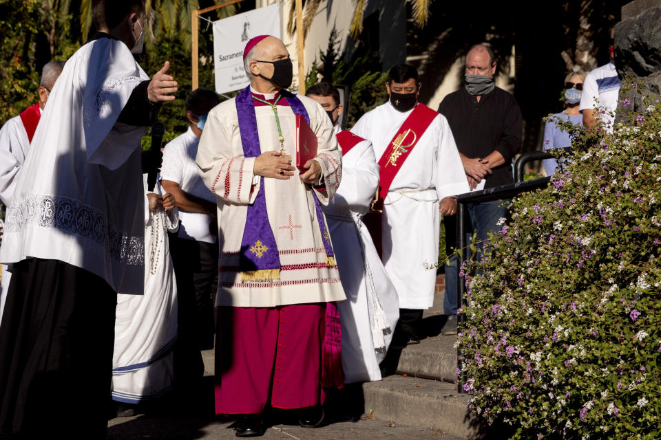 Archbishop Salvatore Cordileone (center) arrives to conduct an exorcism in San Rafael, California, on Oct. 17, 2020, on the spot where a statue of St. Jun&iacute;pero Serra was toppled during a protest five days earlier. (Photo: Jessica Christian/The San Francisco Chronicle via Getty Images)