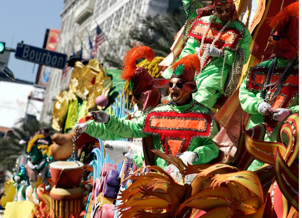 Members of Rex toss beads from a float to revelers during Mardi Gras day in New Orleans, Louisiana. The annual Mardi Gras celebration on Feb. 13 ends at midnight, when the Catholic Lenten season begins on Ash Wednesday and ends on Easter Sunday.