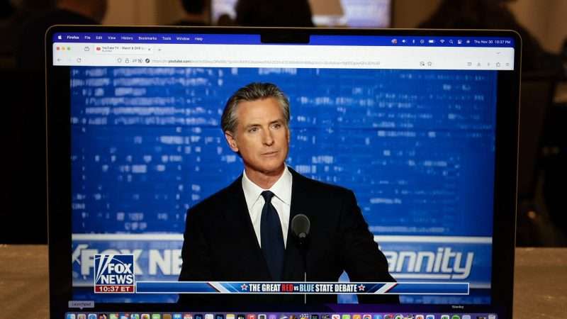 California Governor Gavin Newsom shown on television screen debating on Fox News' "Hannity"