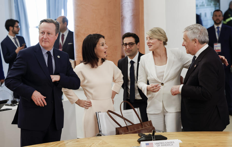 From left, British Foreign Secretary David Cameron, German Foreign Minister Annalena Baerbock, French Foreign Minister Stephane Sejourne, Canadian Minister of Foreign Affairs Melanie Joly and Italian Foreign Minister Antonio Tajani attend a meeting on the second day of a G7 foreign ministers meeting on Capri island, Italy, Thursday April 18, 2024. (Remo Casilli/Pool via AP)