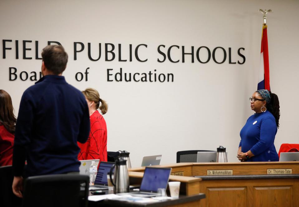 Springfield Public School Board of Education member Shurita Thomas-Tate stands and remained silent during the Pledge of Allegiance during the Feb. 14 meeting.