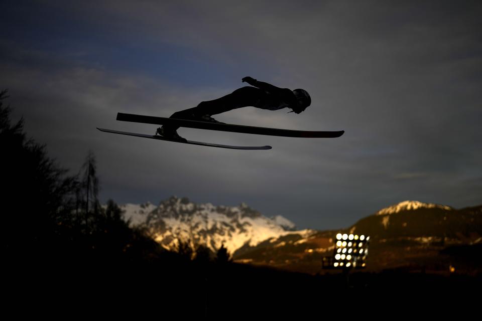 Andreas Wellinger of Germany soars through the air during the fourth stage of the 72th Four Hills ski jumping tournament in Bischofshofen, Austria, Friday, Jan. 5, 2024. (AP Photo/Matthias Schrader)