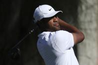 Tony Finau hits from the second tee during the final round of the Waste Management Phoenix Open PGA Tour golf event Sunday, Feb. 2, 2020, in Scottsdale, Ariz. (AP Photo/Ross D. Franklin)