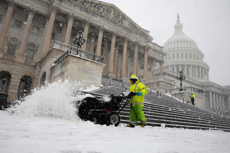 Workers clear the steps of the House of Representatives on Capitol Hill in Washington, U.S., March 21, 2018. REUTERS/Aaron P. Bernstein