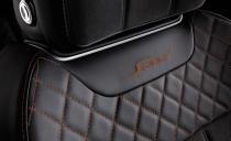 <p>More contrasting leather adorns the door trim, seat edges, and center stack.</p>