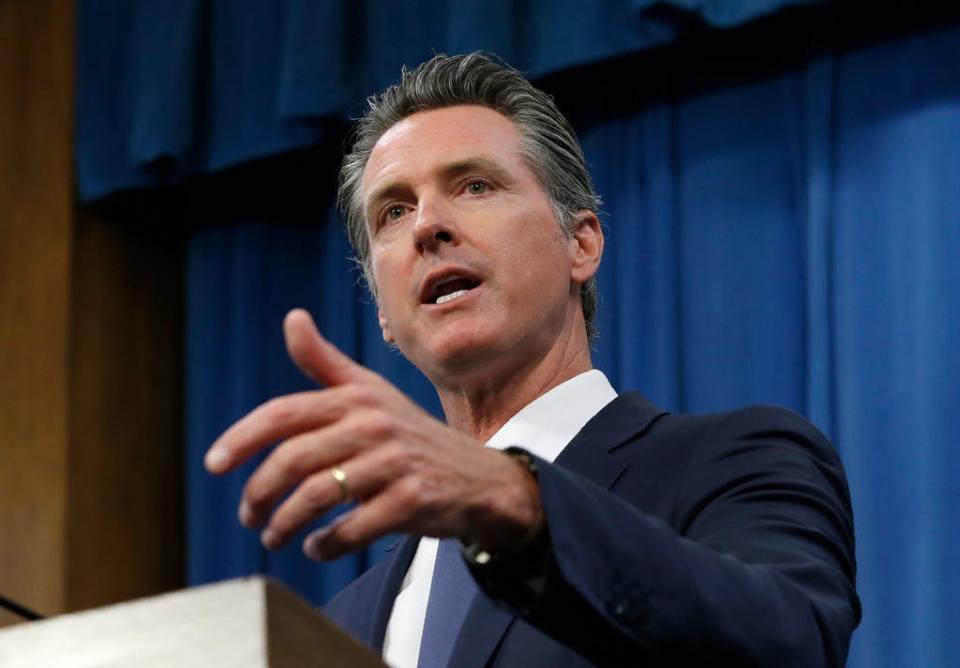 In this July 23, 2019, file photo, Gov. Gavin Newsom talks to reporters at his Capitol office in Sacramento, Calif.