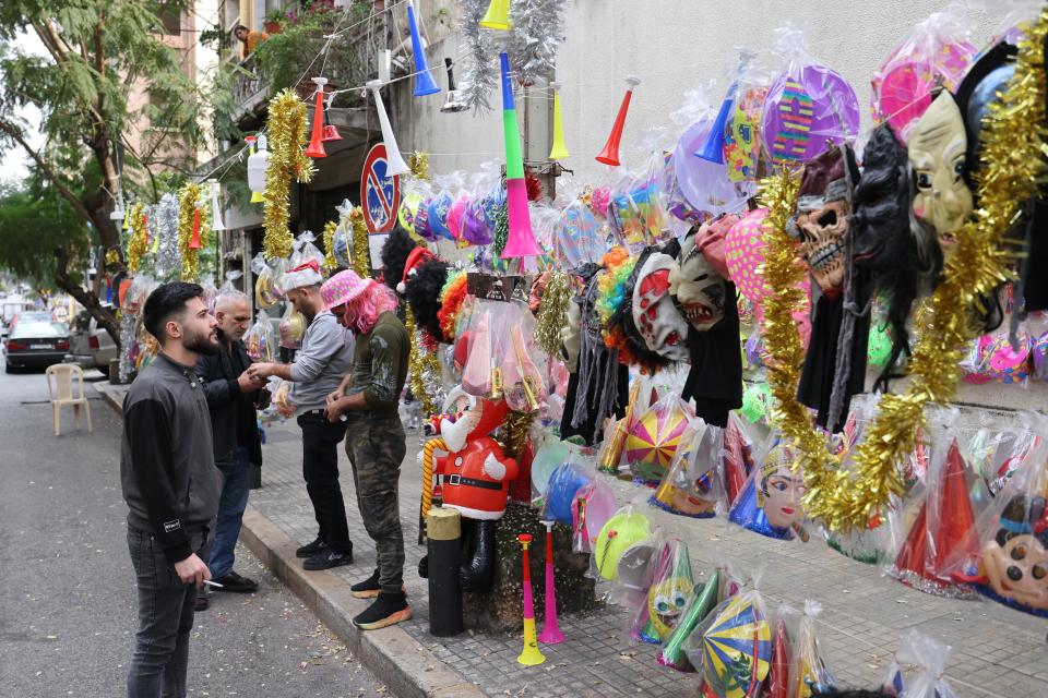 A street vendor sells festive party novelties for New Year's Eve in Beirut (AFP via Getty Images)