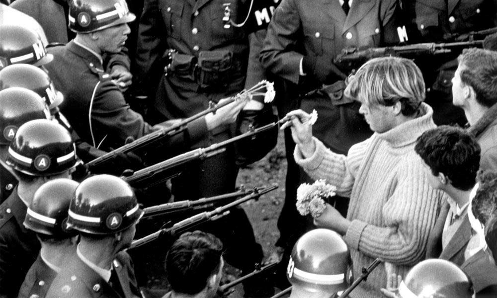 Antiwar demonstrators tried flower power on MPs blocking the Pentagon Building