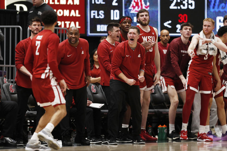 The Washington State bench celebrates after a basket by guard Myles Rice (2) during the second half of an NCAA college basketball game against UCLA, Saturday, March 2, 2024, in Pullman, Wash. (AP Photo/Young Kwak)