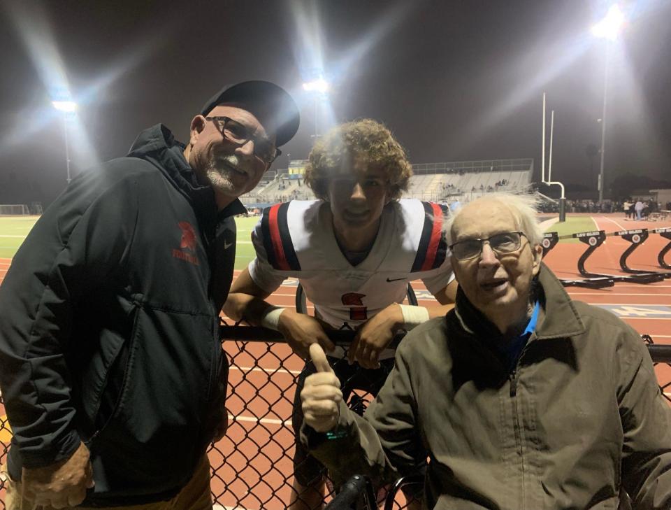 Former Moorpark College coach Jim Bittner (right) poses with his son Jim, the head football coach at Rio Mesa, and his grandson J.J., the Rio Mesa High quarterback, after the Spartans' 14-13 win over Buena in September 2022.