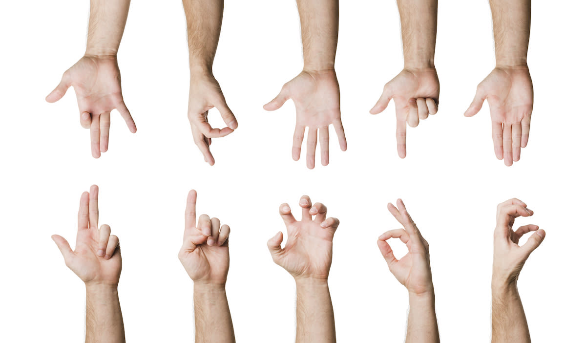 Ten hands displaying sign language symbols.