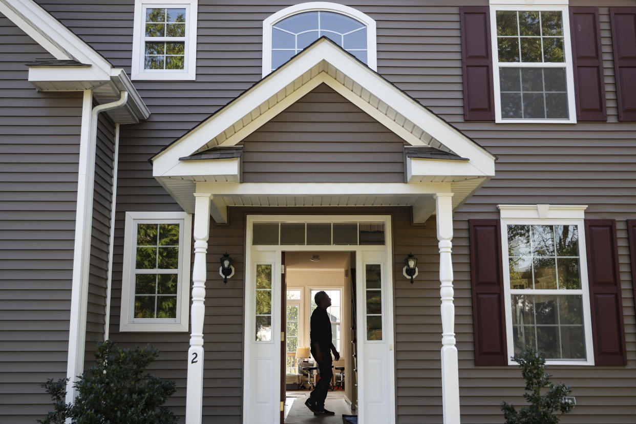 A homeowner tours his new home, in Washingtonville, N.Y. (Credit: John Minchillo, AP Photo)