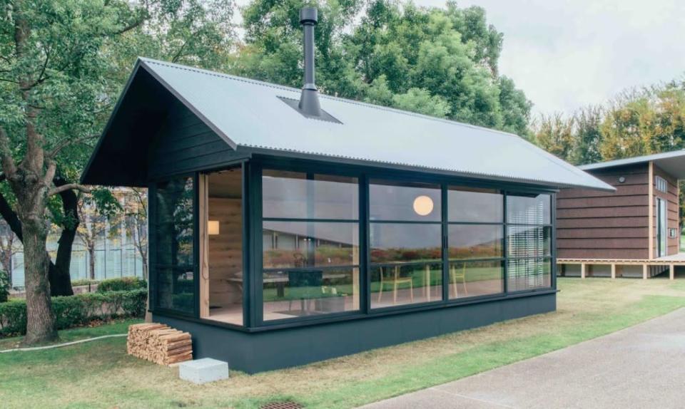 Fukasawa’s forest green ‘Hut of Wood’ from the outside. 