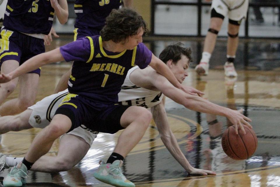 Merkel's Ryder Hoyle and Clyde's Evan Laughlin scramble for a loose ball.