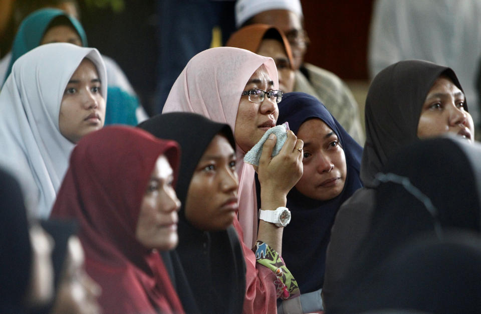 Family members wait for news of their loved ones outside religious school Darul Quran Ittifaqiyah after a fire broke out in Kuala Lumpur, Malaysia September 14, 2017. REUTERS/Lai Seng Sin