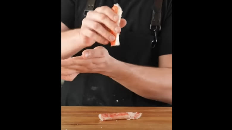 person demonstrating the crab peeling trick