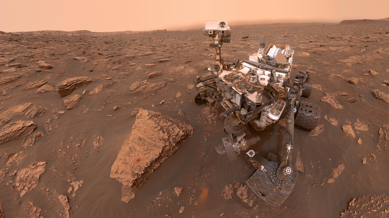 Curiosity snaps a selfie on Mars. Note the wear-and-tear on its wheels. 