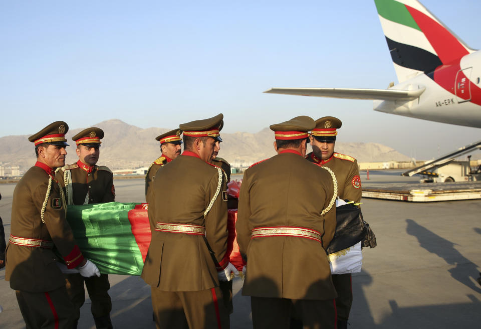 The coffin of Japanese physician Tetsu Nakamura is loaded into a plane after a ceremony at the Hamid Karzai International Airport in Kabul, Afghanistan, Saturday, Dec. 7, 2019. Nakamura was killed earlier this week in a roadside shooting in eastern Afghanistan. (AP Photo/Rahmat Gul)