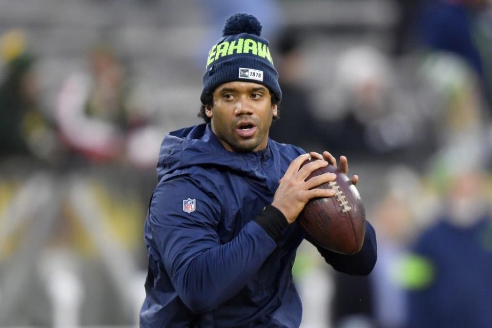 Russell Wilson #3 of the Seattle Seahawks warms up before taking on the Green Bay Packers in the NFC Divisional Playoff game at Lambeau Field on January 12, 2020 in Green Bay, Wisconsin. (Photo by Quinn Harris/Getty Images)