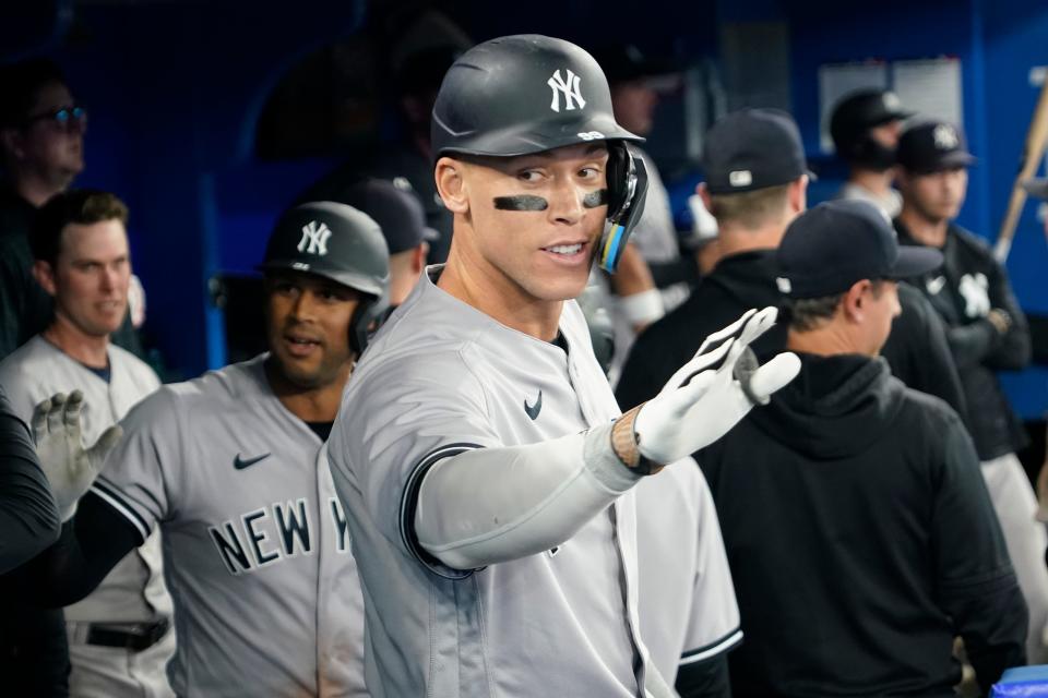 May 16, 2023; Toronto, Ontario, CAN; New York Yankees designated hitter Aaron Judge (99) celebrates in the dugout after hitting a two run home run against the Toronto Blue Jays during the eighth inning at Rogers Centre. Mandatory Credit: John E. Sokolowski-USA TODAY Sports