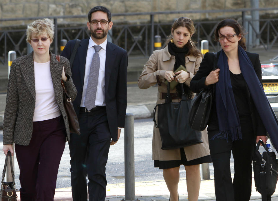 FILE - Negotiators from Cyprus' potential creditors, from left to right Mary McCarthy, Matteo Duiella, Daphne Momferatou and Datka Funke walk toward the Cypriot Finance Ministry in capital Nicosia, in this Friday, Nov 9, 2012 file photo. The creditors said Friday Nov 23 2012 they have made "good progress" in negotiations on a possible bailout for the crisis-hit country. Despite earlier hopes that a deal was imminent, they said long-distance talks would continue on securing an agreement that will make Cyprus the fourth euro country to receive international help with its debts. (AP Photo/Petros Karadjias, File)