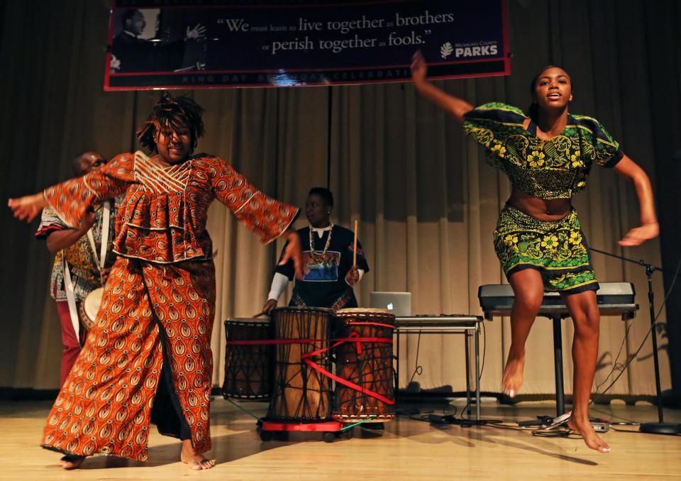 Members from Ina (cq) Onilu (cq) and Drum Dance Ensemble, from left, Akilah (cq) Young and Brooklyn Nation perform  at the 'Take me to the King' program to honor civil rights leader Dr. Martin Luther King Jr. at the Dr. Martin Luther King Jr. Community Center on Monday, Jan. 20, 2020.