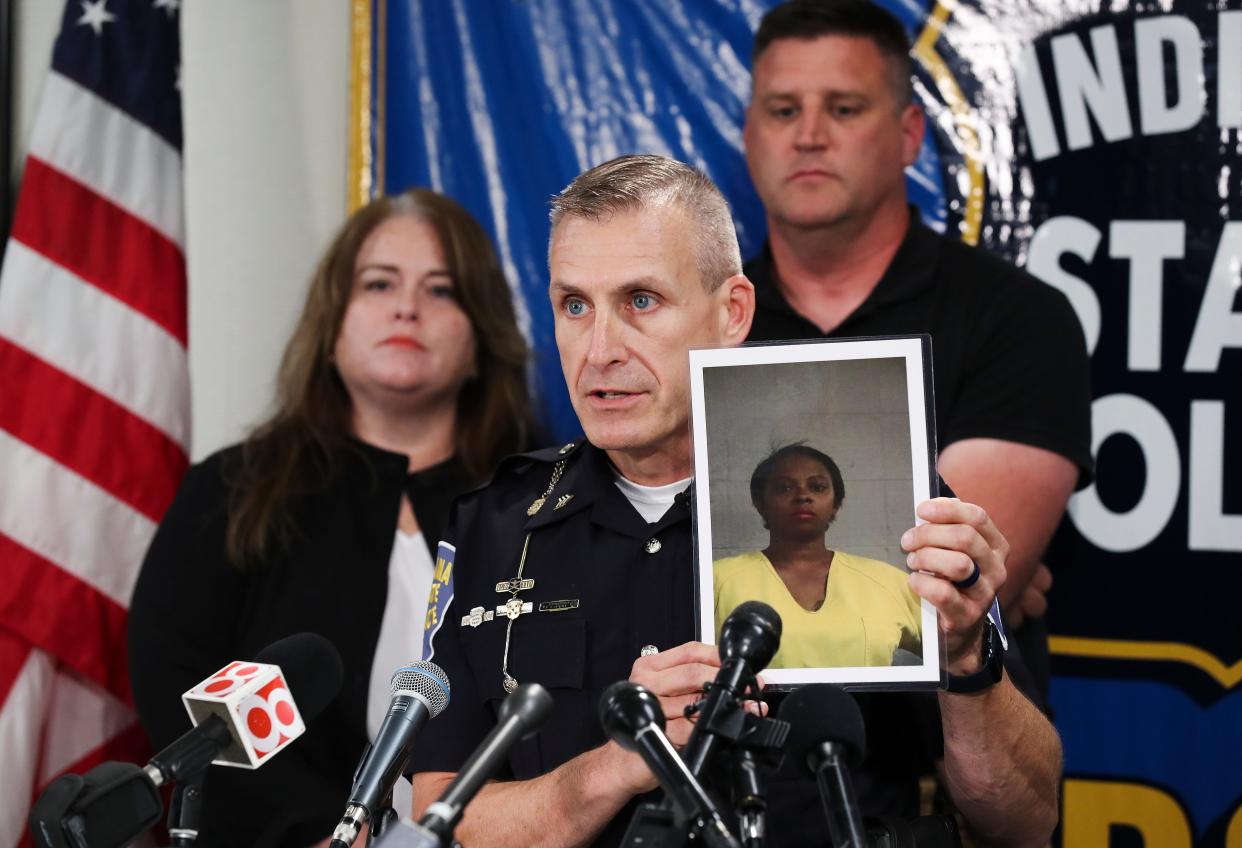 Indiana State Police Sgt. Carey Huls held up a photo of Dejuane Ludie Anderson who has been charged in connection to the death of her son Cairo Jordan, who was 5 at the time, during a press conference at the Indiana State Police Sellersburg Post in Sellersburg, In. on Oct. 26, 2022.