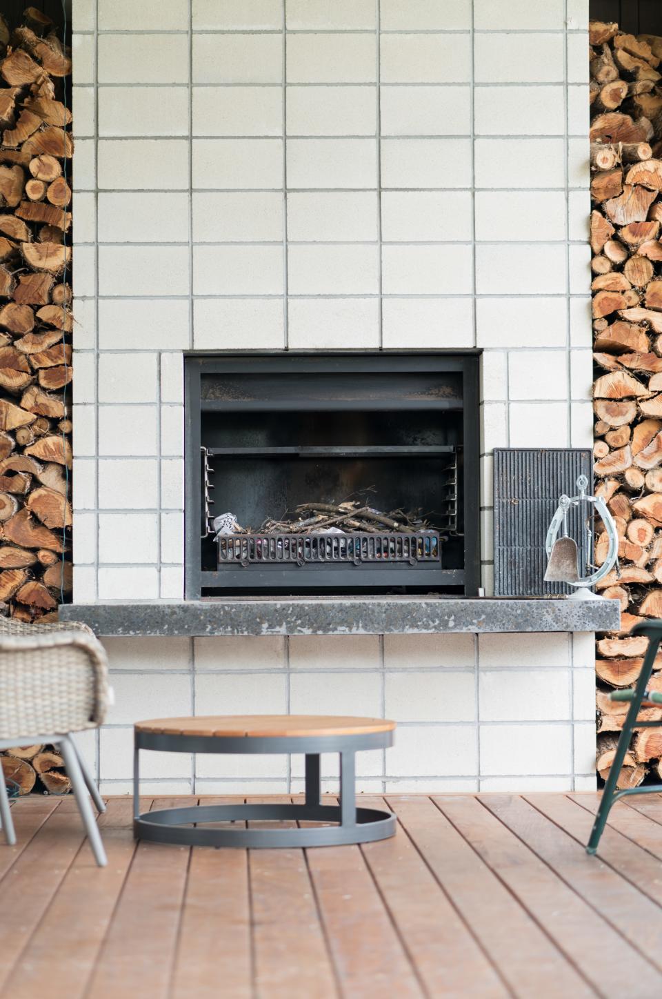 Let a double-sided fireplace do double duty