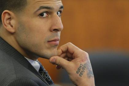 Aaron Hernandez listens as prosecution witness Alexander Bradley testifies against him. (REUTERS)