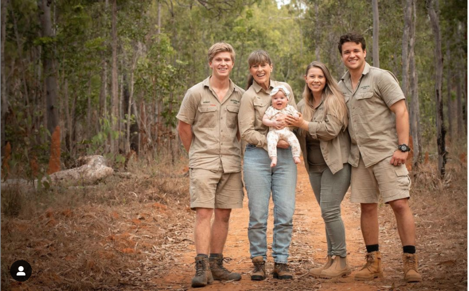 Terri Irwin holds granddaughter Grace with Robert and Bindi by her side and Bindi&#39;s husband Chandler.