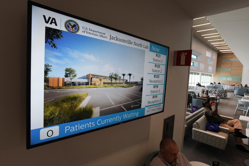 An informational monitor is displayed inside the public area of the new Jacksonville North VA Clinic & Domiciliary.