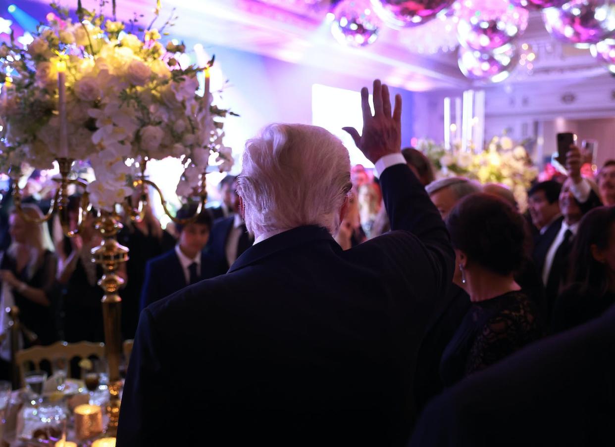 Donald Trump waves to people during a New Year's event at his Mar-a-Lago home in December 2022. <a href="https://media.gettyimages.com/id/1453537376/photo/donald-trump-addresses-the-press-on-new-years-eve-at-mar-a-lago-mansion.jpg?s=1024x1024&w=gi&k=20&c=ZPmora_FI5LKPZ9ezZ3DTxKoHRFR0iuAkvGdPSewxJ4=" rel="nofollow noopener" target="_blank" data-ylk="slk:Joe Raedle/Getty Images;elm:context_link;itc:0;sec:content-canvas" class="link ">Joe Raedle/Getty Images</a>
