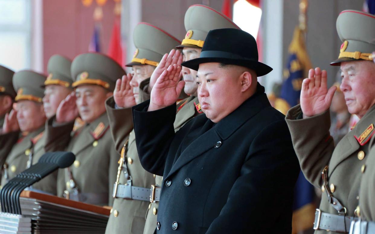 Kim Jong-un attending a military parade to mark the 70th anniversary of the Korean People's Army - AFP