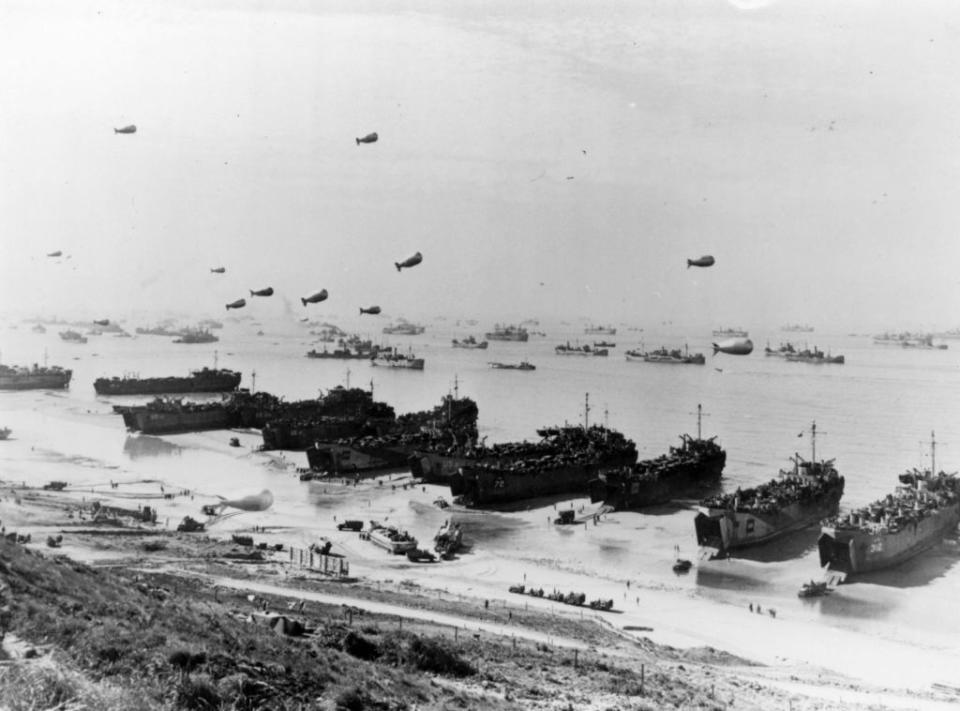 Barrage balloons and shipping at Omaha Beach during the Allied amphibious assault, before the installation of Mulberry Harbour. (Photo by Three Lions/Getty Images)