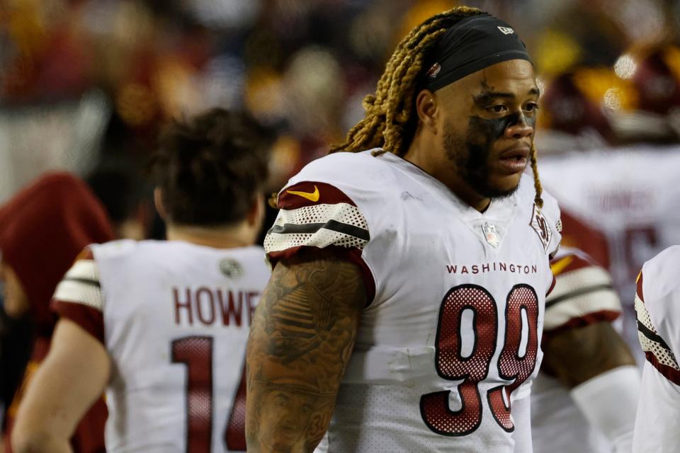 Washington Commanders defensive end Chase Young (99) stands on the sidelines against the Dallas Cowboys at FedExField.